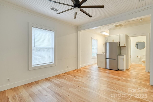 interior space featuring crown molding, ceiling fan, and light hardwood / wood-style floors