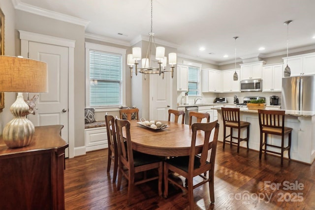 dining room with crown molding, dark hardwood / wood-style floors, and an inviting chandelier