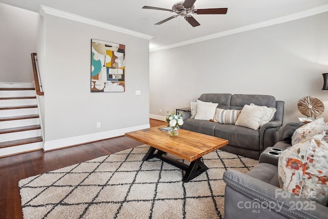 living room featuring hardwood / wood-style flooring, ceiling fan, and crown molding