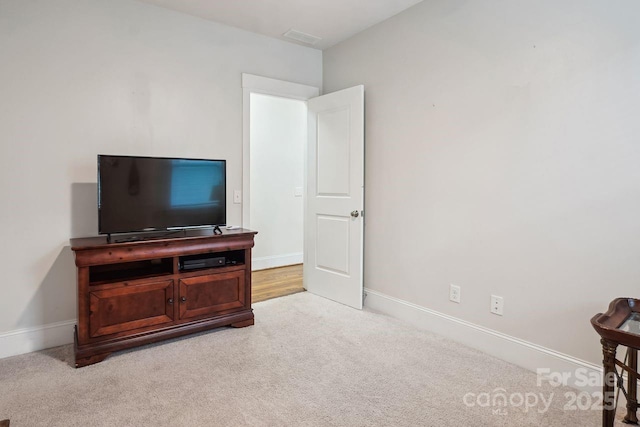 bedroom featuring light carpet