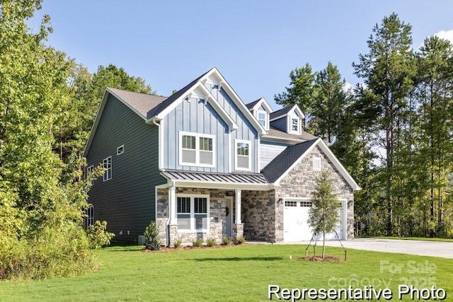 craftsman-style home with a garage, a front lawn, and covered porch