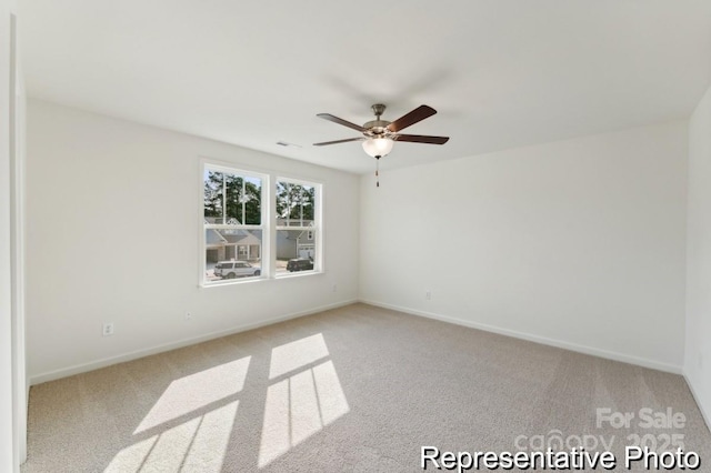 unfurnished room with light carpet and ceiling fan