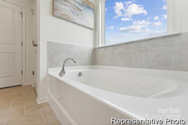 bathroom featuring a bath and tile patterned floors