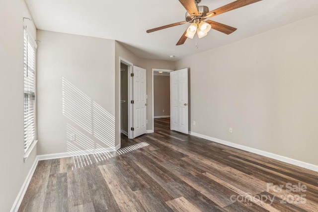 unfurnished bedroom with dark hardwood / wood-style flooring and ceiling fan