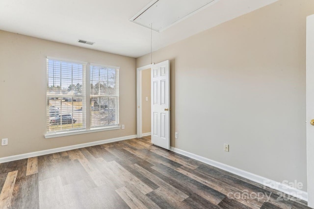 empty room with dark hardwood / wood-style floors