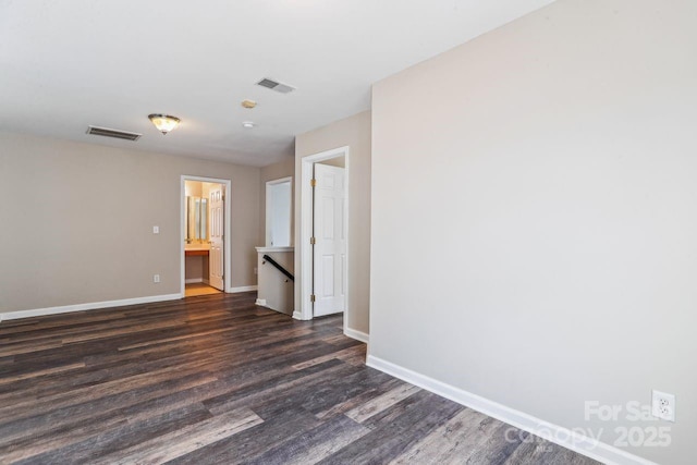 empty room featuring dark hardwood / wood-style flooring