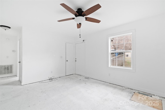 spare room with ceiling fan