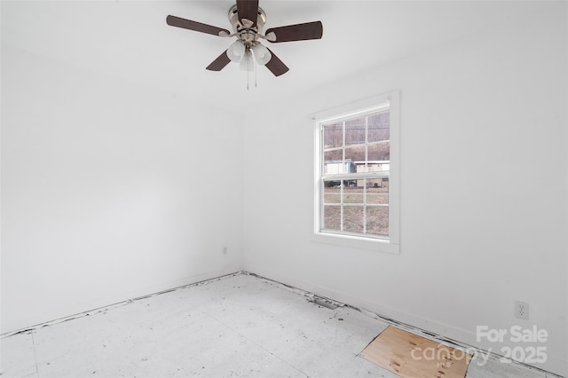 spare room with ceiling fan