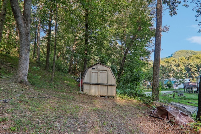 view of outbuilding with a mountain view