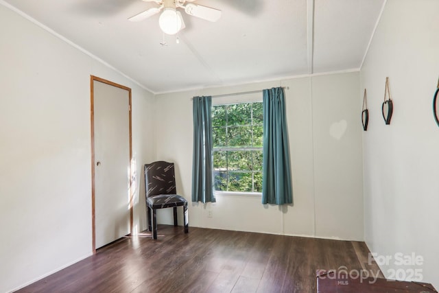 empty room with ornamental molding, dark hardwood / wood-style floors, and ceiling fan