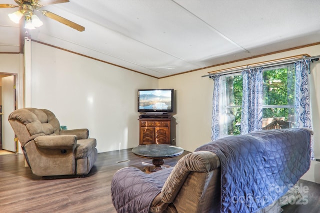 living room featuring hardwood / wood-style flooring and crown molding