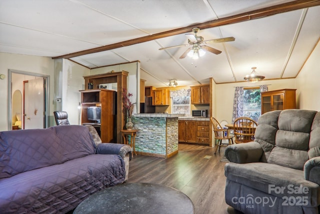 living room with lofted ceiling with beams, dark wood-type flooring, and ceiling fan