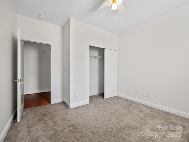 unfurnished bedroom featuring light carpet, ceiling fan, and a closet