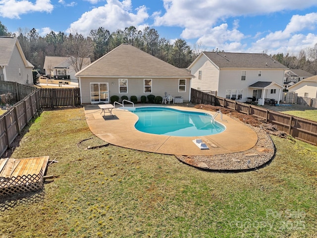 view of swimming pool featuring a yard and a patio