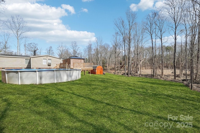 view of yard with an outdoor pool