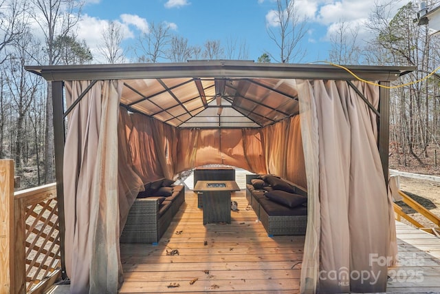 wooden deck featuring a gazebo