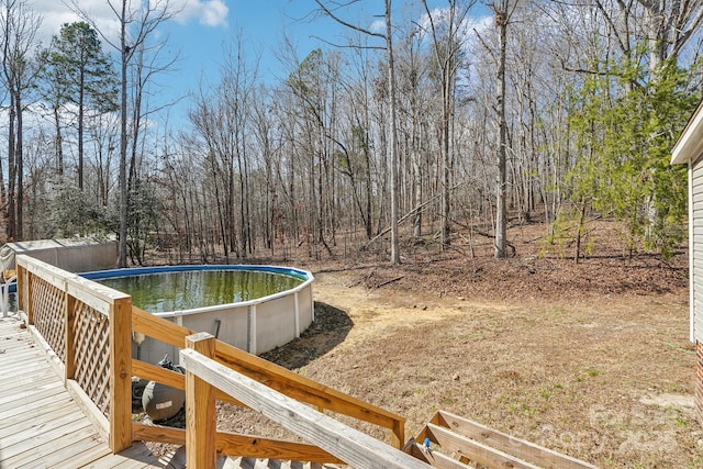 view of yard featuring an outdoor pool