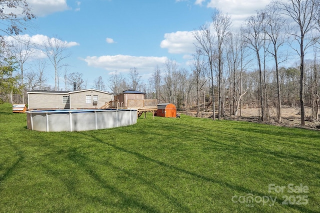 view of yard featuring an outdoor pool