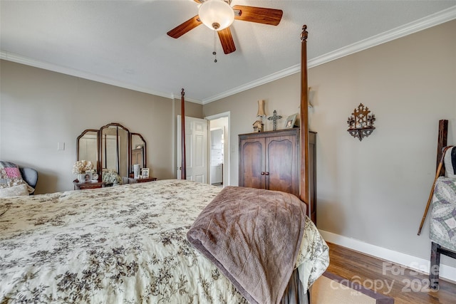 bedroom featuring dark hardwood / wood-style flooring, ornamental molding, and ceiling fan