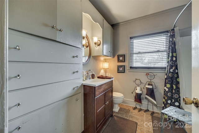 bathroom with tile patterned floors, vanity, and toilet