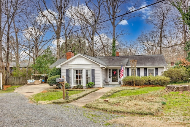 ranch-style home with a front yard