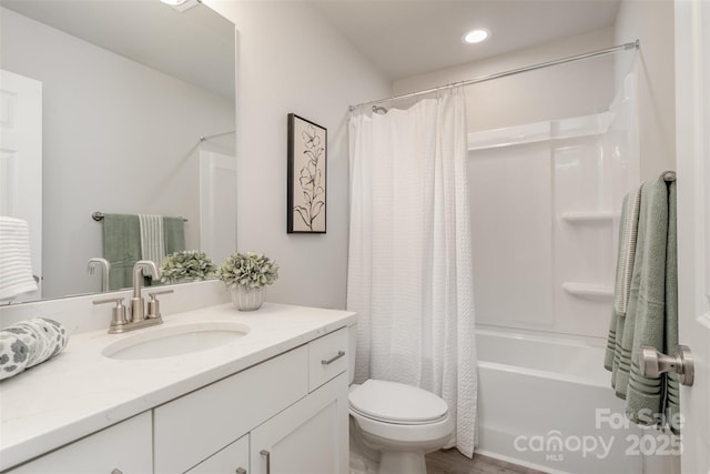 full bathroom featuring vanity, shower / bath combo, and toilet