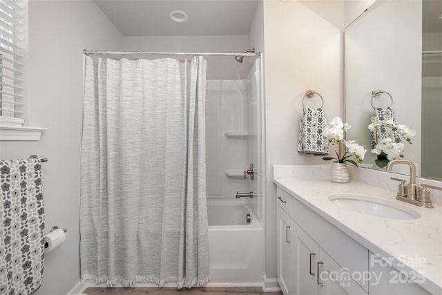 bathroom featuring shower / tub combo with curtain and vanity