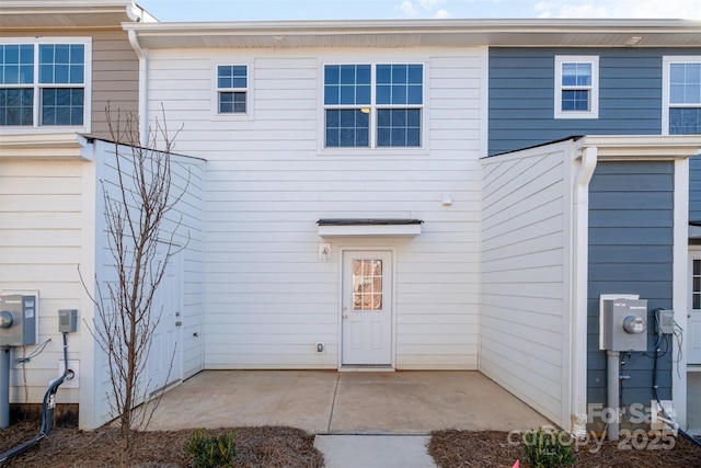 back of property with a patio