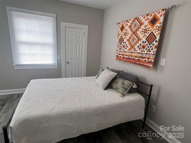 bedroom featuring dark hardwood / wood-style flooring