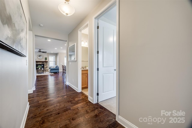 corridor with dark wood-type flooring