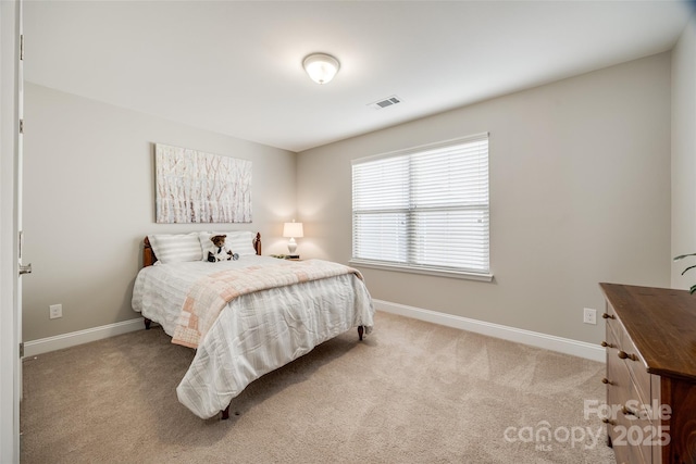 bedroom with light carpet