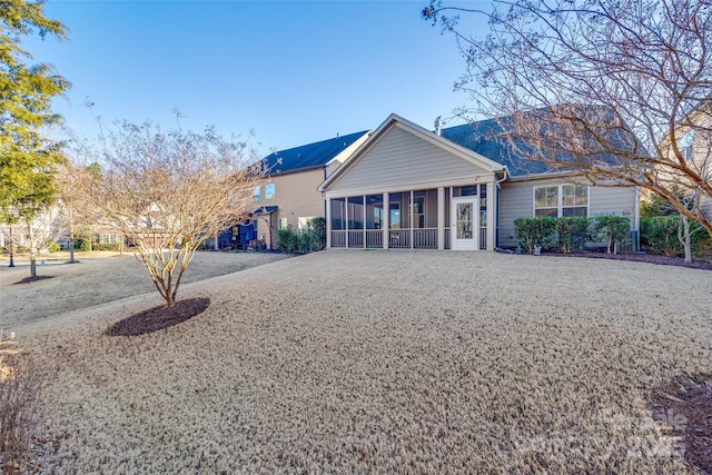 back of property featuring a sunroom