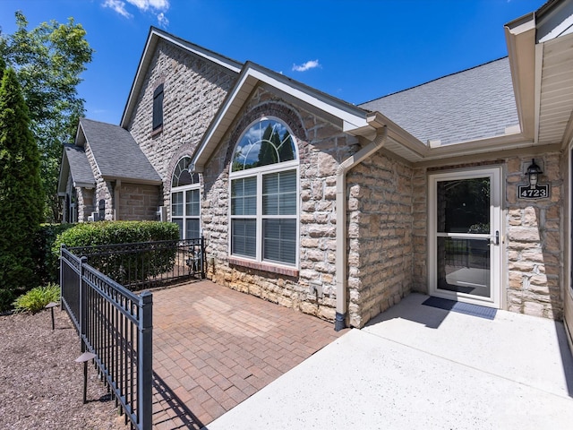 entrance to property featuring a patio