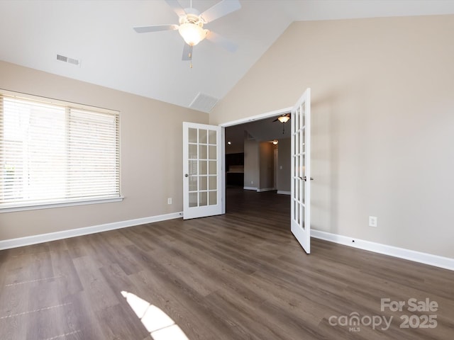 spare room with high vaulted ceiling, dark wood-type flooring, ceiling fan, and french doors