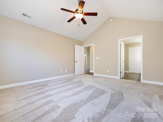 unfurnished bedroom featuring ceiling fan, light colored carpet, and high vaulted ceiling