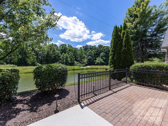 view of patio with a water view