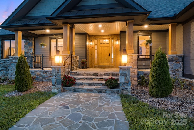 doorway to property with covered porch