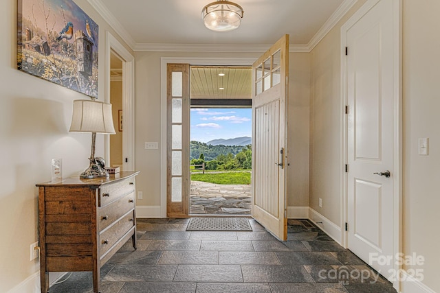 entryway featuring a mountain view and ornamental molding