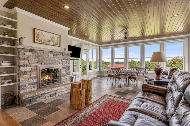 living room with crown molding, a fireplace, and wood ceiling