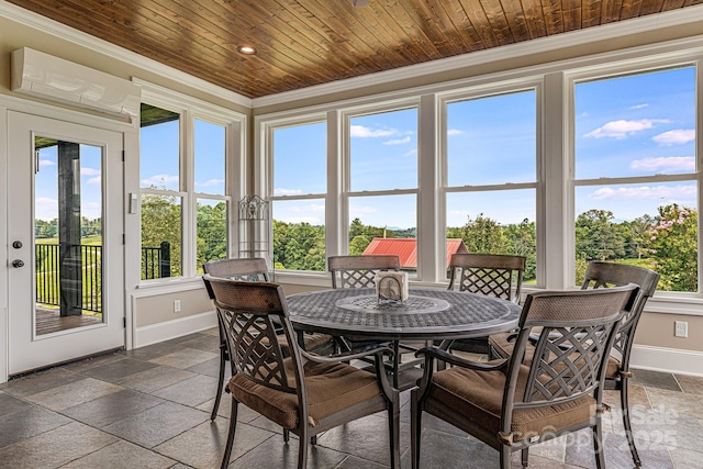 sunroom / solarium featuring wood ceiling