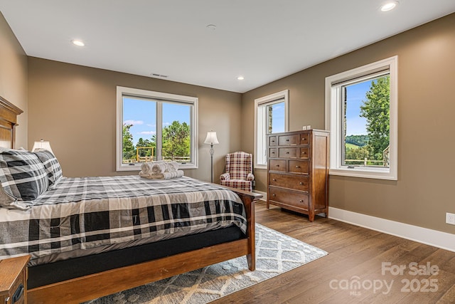 bedroom with light hardwood / wood-style flooring