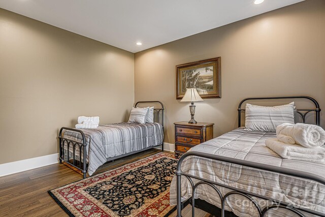 bedroom featuring dark hardwood / wood-style flooring