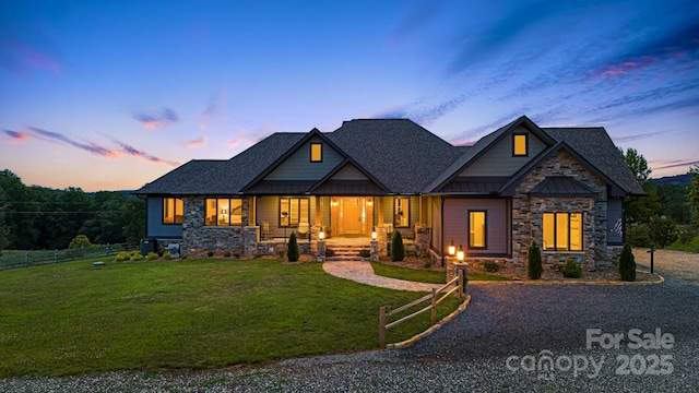 craftsman-style home featuring a yard and covered porch