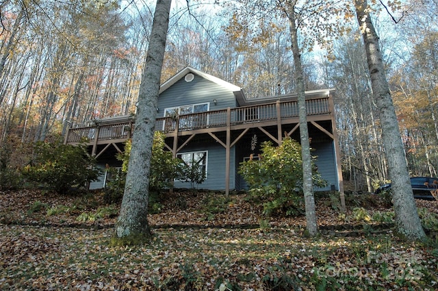 back of property with a wooden deck