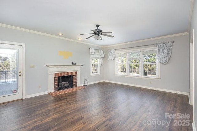 unfurnished living room with dark hardwood / wood-style flooring, ornamental molding, ceiling fan, and a fireplace