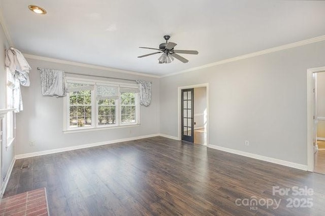 spare room with ceiling fan, ornamental molding, and dark hardwood / wood-style floors