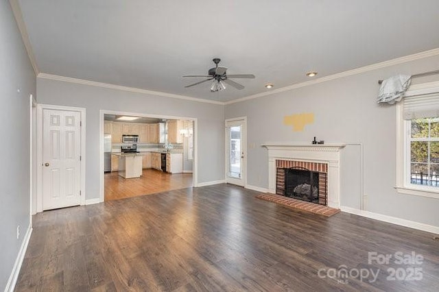 unfurnished living room featuring ornamental molding, a brick fireplace, dark wood-type flooring, and ceiling fan