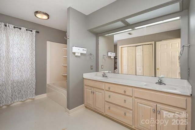 bathroom with vanity and shower / bath combo