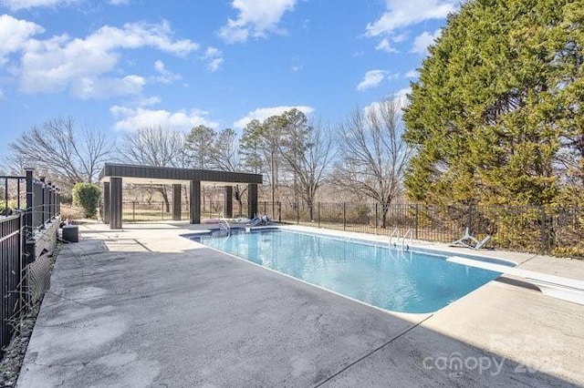 view of pool with a gazebo, a diving board, and a patio