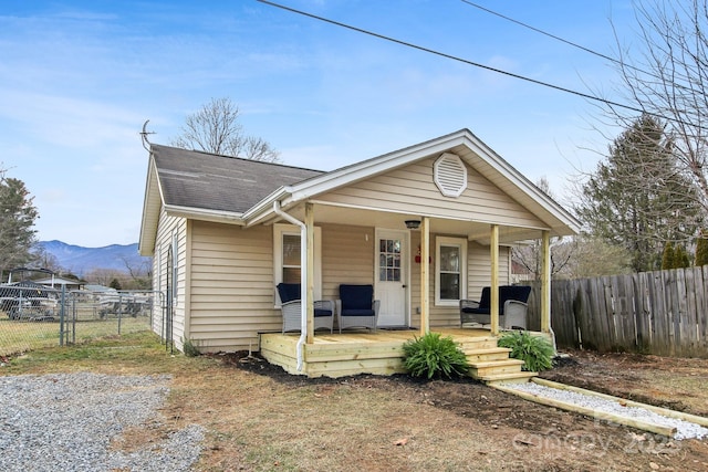 bungalow-style home with a porch and a mountain view